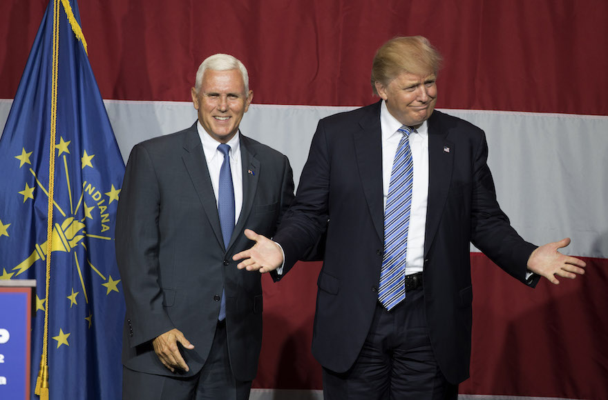 Presumptive US Republican presidential candidate Donald Trump (R) and Indiana Governor Mike Pence (L) take the stage during a campaign rally at Grant Park Event Center in Westfield, Indiana, on July 12, 2016. / AFP / Tasos KATOPODIS (Photo credit should read TASOS KATOPODIS/AFP/Getty Images)